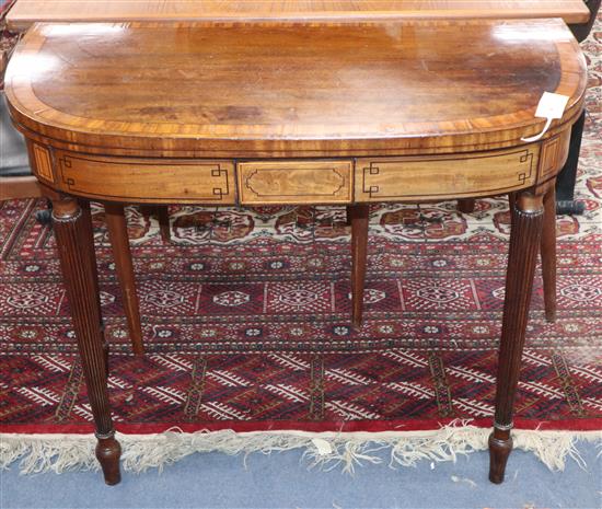 A George IV satinwood banded mahogany D shaped card table W.84cm